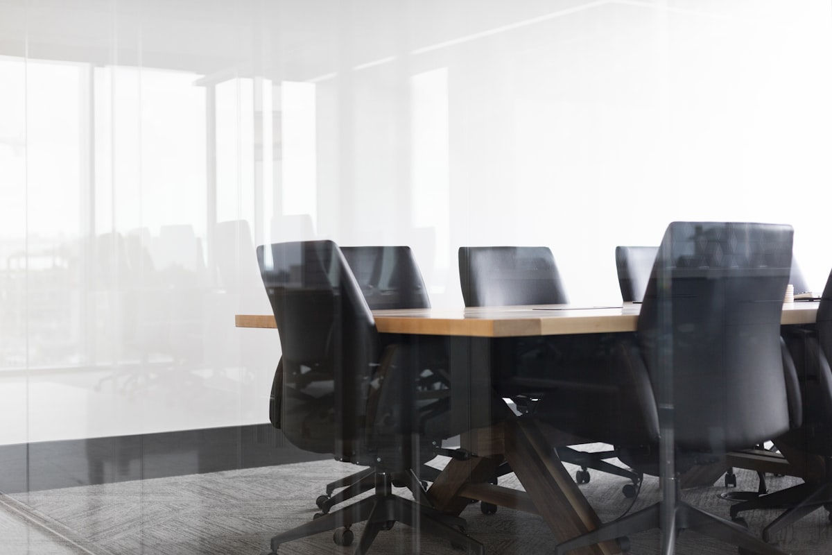 Modern boardroom with conference table and glass walls